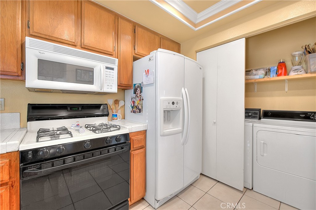 8576 Salina Street Rancho Cucamonga, CA 91730 - Photo 16 of 33 a stove top oven sitting inside of a kitchen