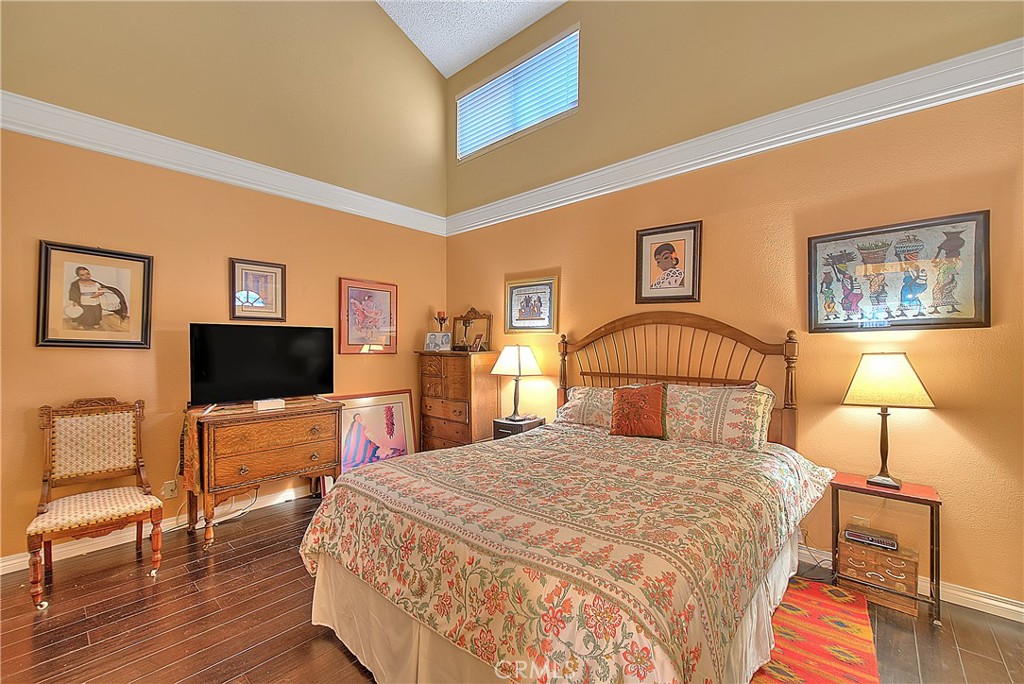 8576 Salina Street Rancho Cucamonga, CA 91730 - Photo 20 of 33 a bedroom with a bed and a flat screen tv