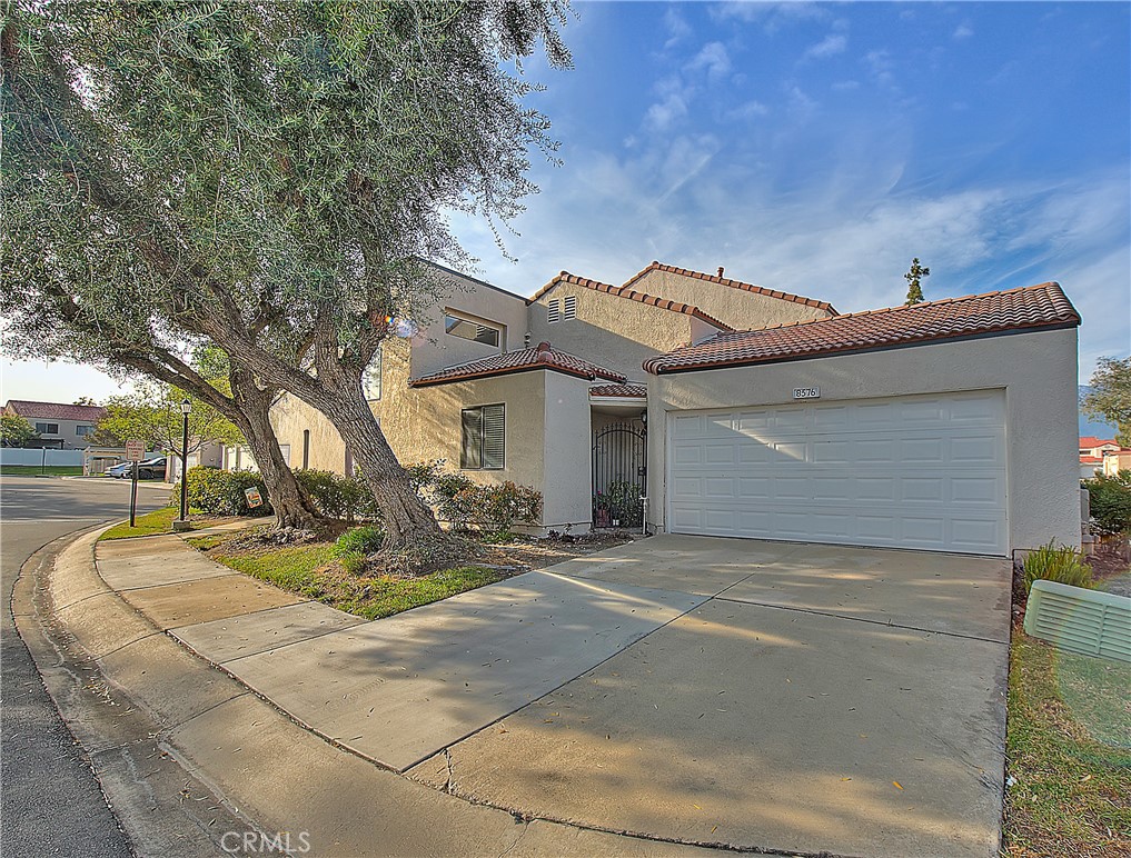 8576 Salina Street Rancho Cucamonga, CA 91730 - Photo 2 of 33 a view of a house with basket ball court and a fire pit