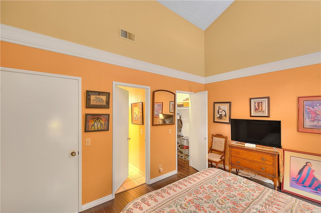8576 Salina Street Rancho Cucamonga, CA 91730 - Photo 22 of 33 a bedroom with furniture and a flat screen tv