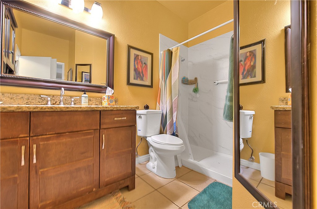 8576 Salina Street Rancho Cucamonga, CA 91730 - Photo 27 of 33 a bathroom with a sink a toilet and shower