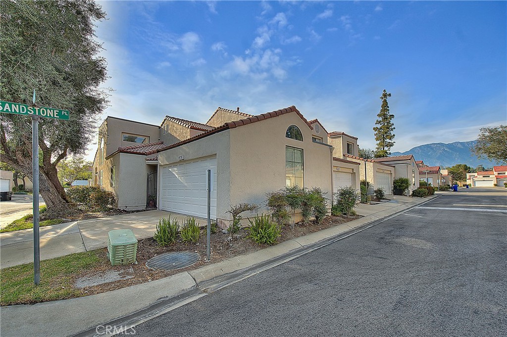 8576 Salina Street Rancho Cucamonga, CA 91730 - Photo 3 of 33 a front view of a house with garden