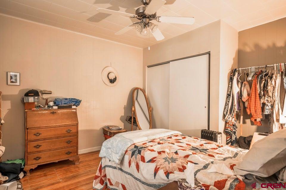 603 East First Street Trinidad, CO 81082 - Photo 12 of 37 a bedroom with a bed and a dresser