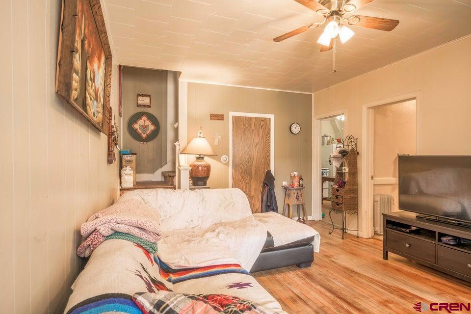 603 East First Street Trinidad, CO 81082 - Photo 27 of 37 a bedroom with a bed and a flat screen tv