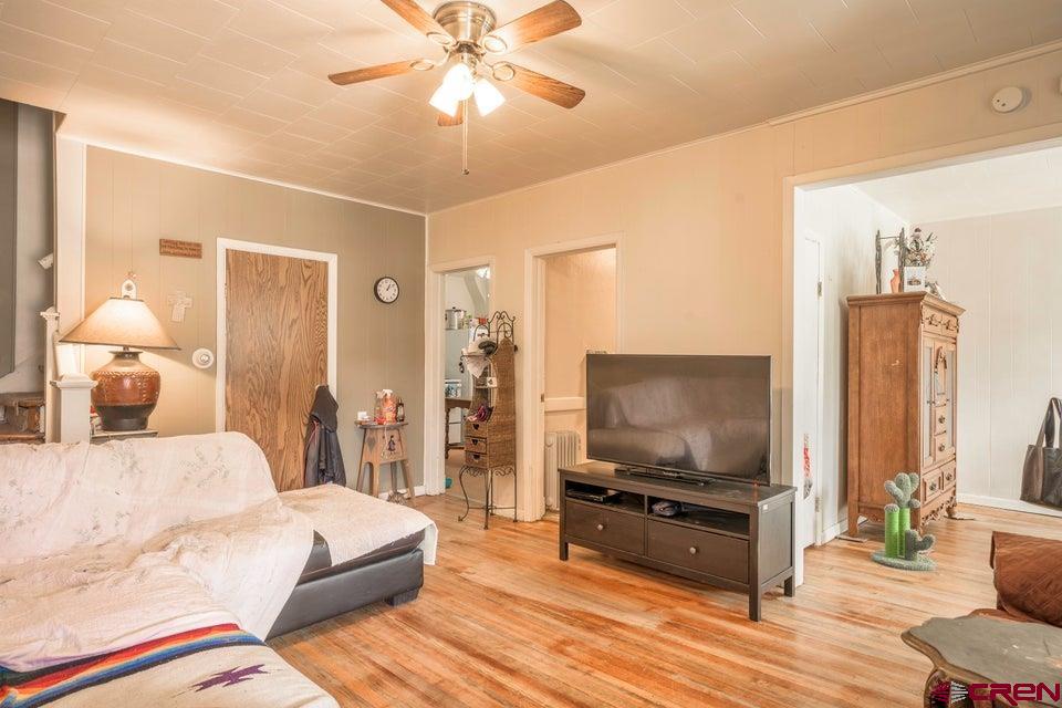 603 East First Street Trinidad, CO 81082 - Photo 28 of 37 a living room with furniture and a flat screen tv