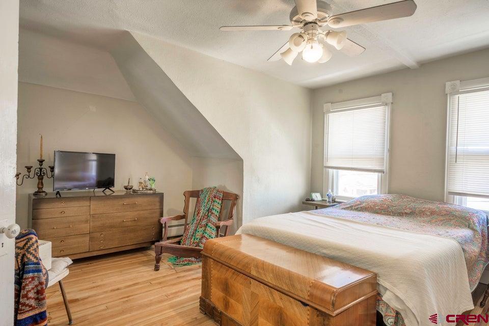 603 East First Street Trinidad, CO 81082 - Photo 3 of 37 a bedroom with a bed and flat screen tv