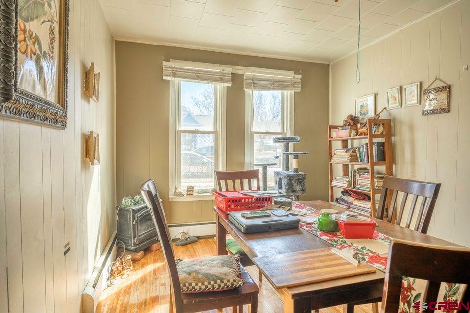 603 East First Street Trinidad, CO 81082 - Photo 31 of 37 a view of a dining room with furniture a rug and wooden floor