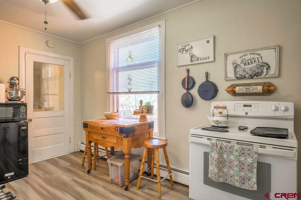 603 East First Street Trinidad, CO 81082 - Photo 34 of 37 a dining room with wooden floor and next to a window