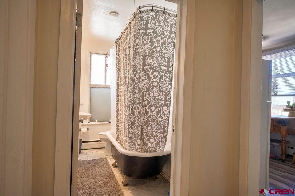 603 East First Street Trinidad, CO 81082 - Photo 36 of 37 a view of a bathroom with bathtub and shower
