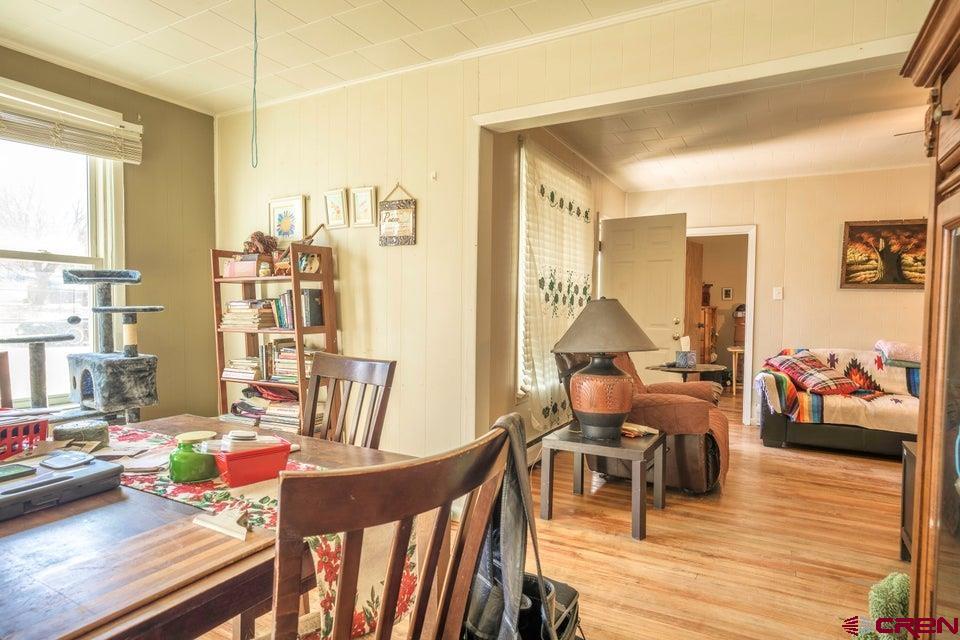 603 East First Street Trinidad, CO 81082 - Photo 6 of 37 a living room with furniture and wooden floor