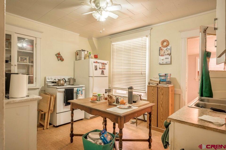 603 East First Street Trinidad, CO 81082 - Photo 7 of 37 a view of a workspace with furniture and a window