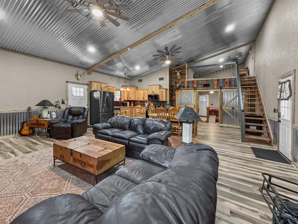 1477 Cedar Mills Road Gordonville, TX 76245 - Photo 3 of 21 Living area featuring light wood-style flooring and ceiling fan