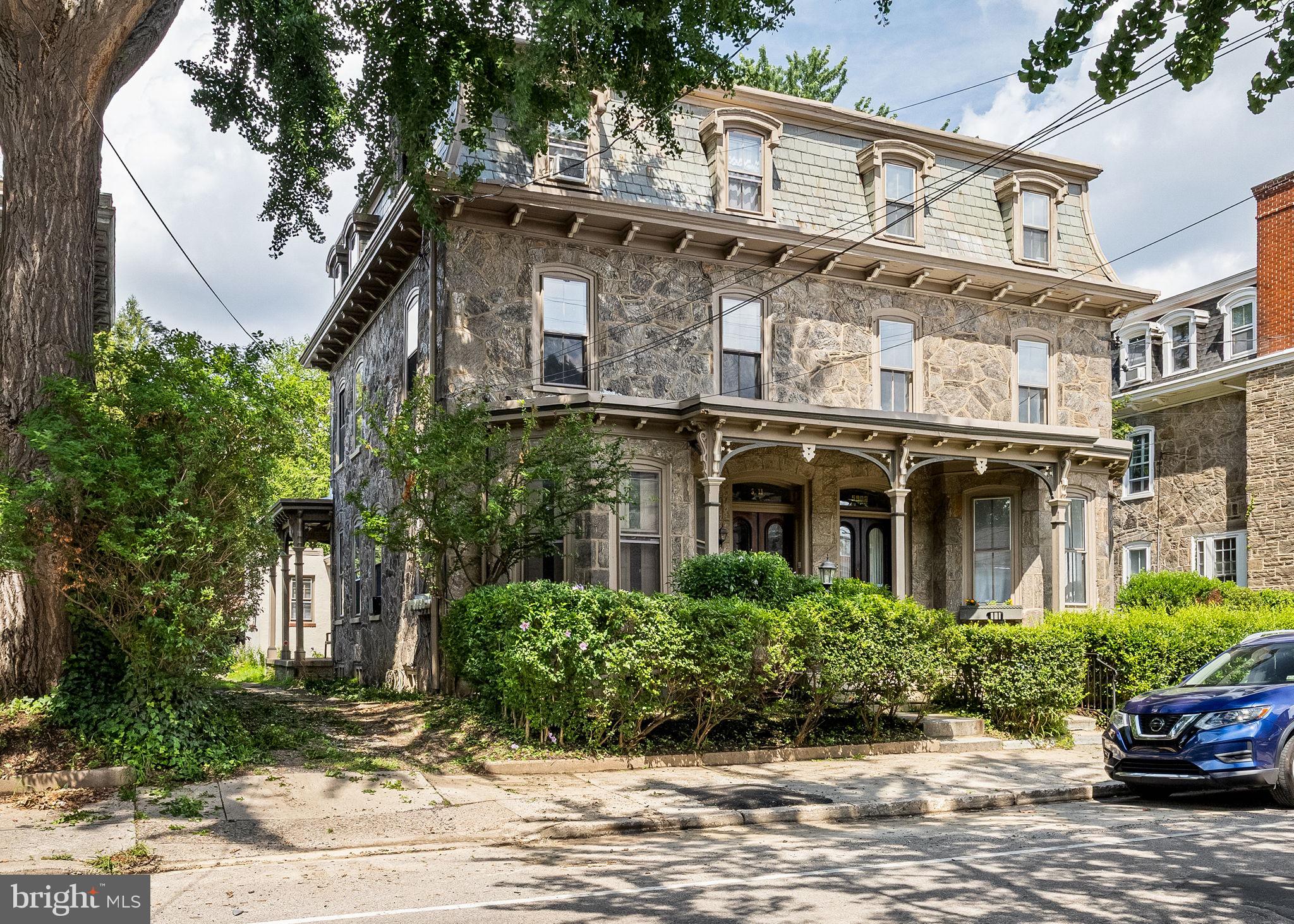 5911 Greene Street Philadelphia, PA 19144 - Photo 1 of 52 a view of a building with a garden