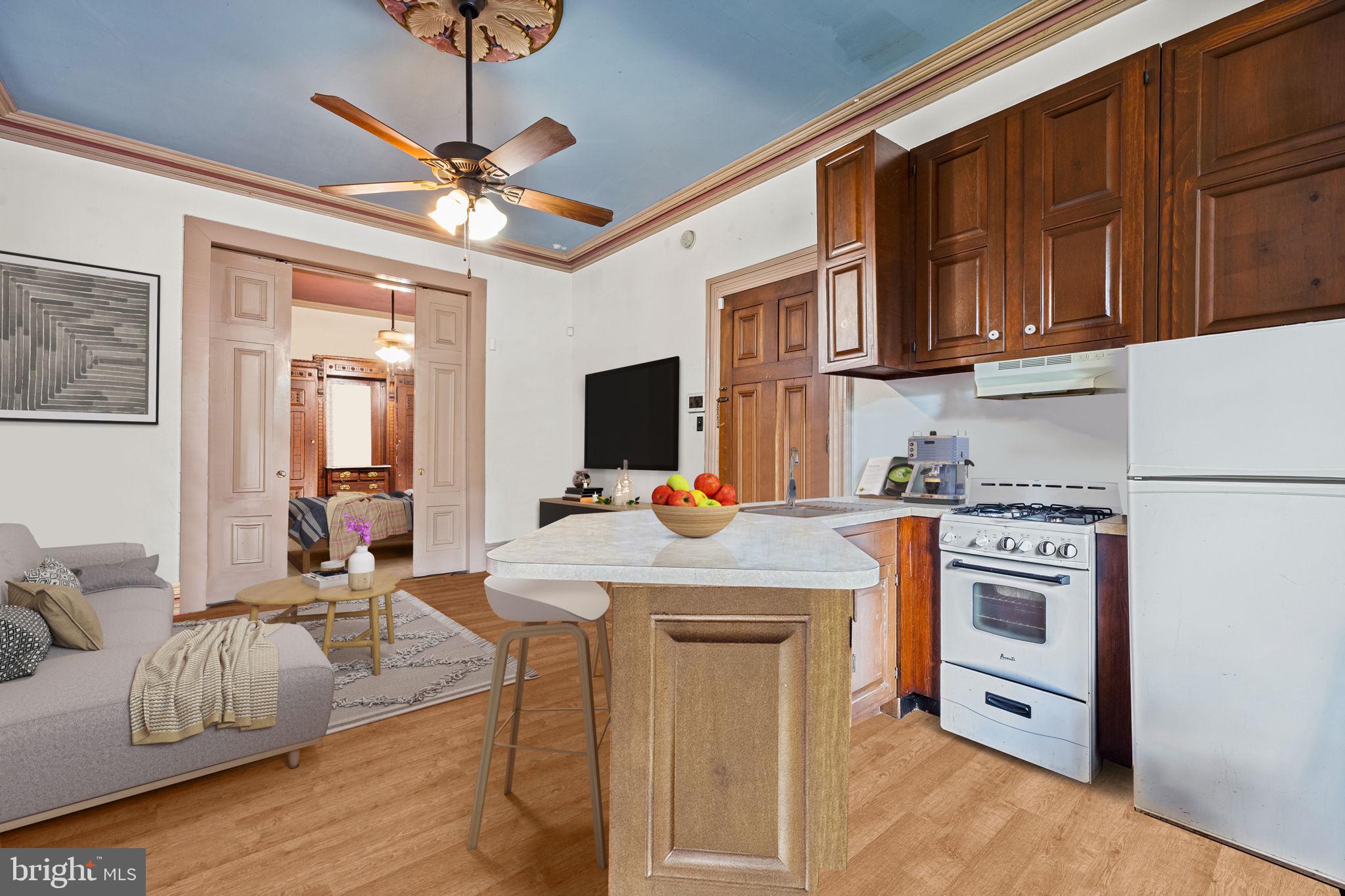 5911 Greene Street Philadelphia, PA 19144 - Photo 12 of 52 a kitchen with stainless steel appliances granite countertop a stove refrigerator and cabinets
