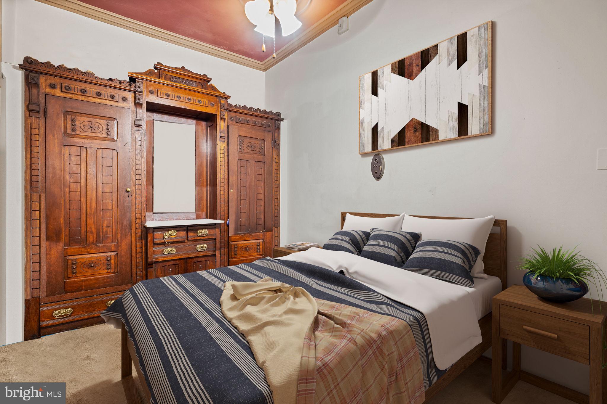 5911 Greene Street Philadelphia, PA 19144 - Photo 13 of 52 a bedroom with a bed and a dresser