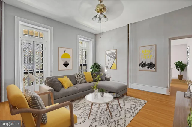 a living room with furniture and a rug