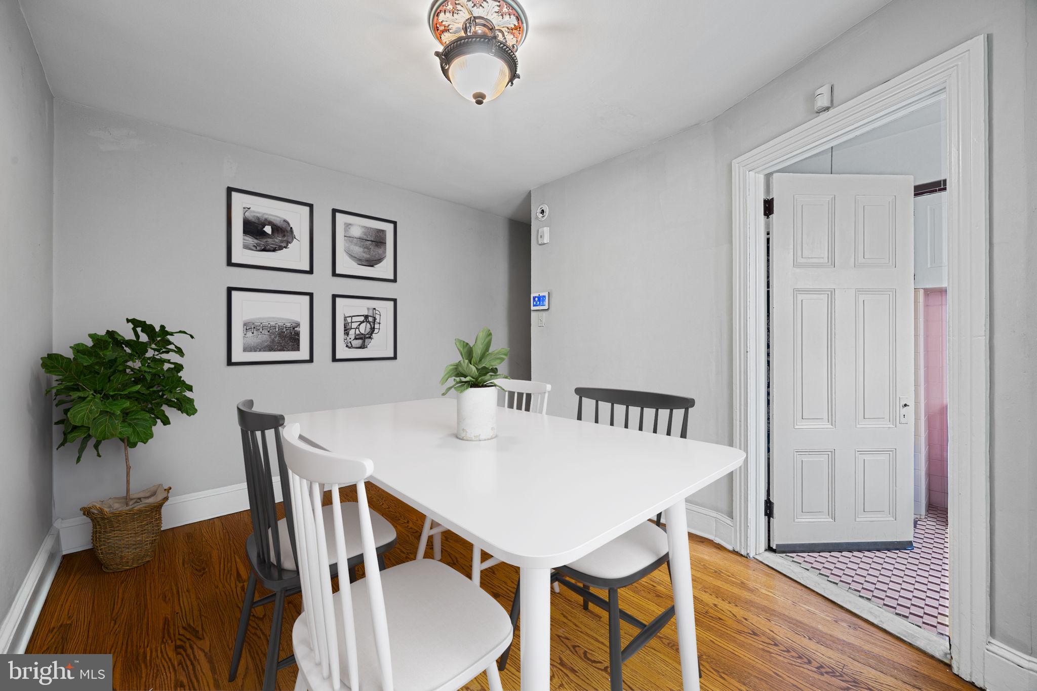 5911 Greene Street Philadelphia, PA 19144 - Photo 19 of 52 a view of a dining room with furniture and wooden floor