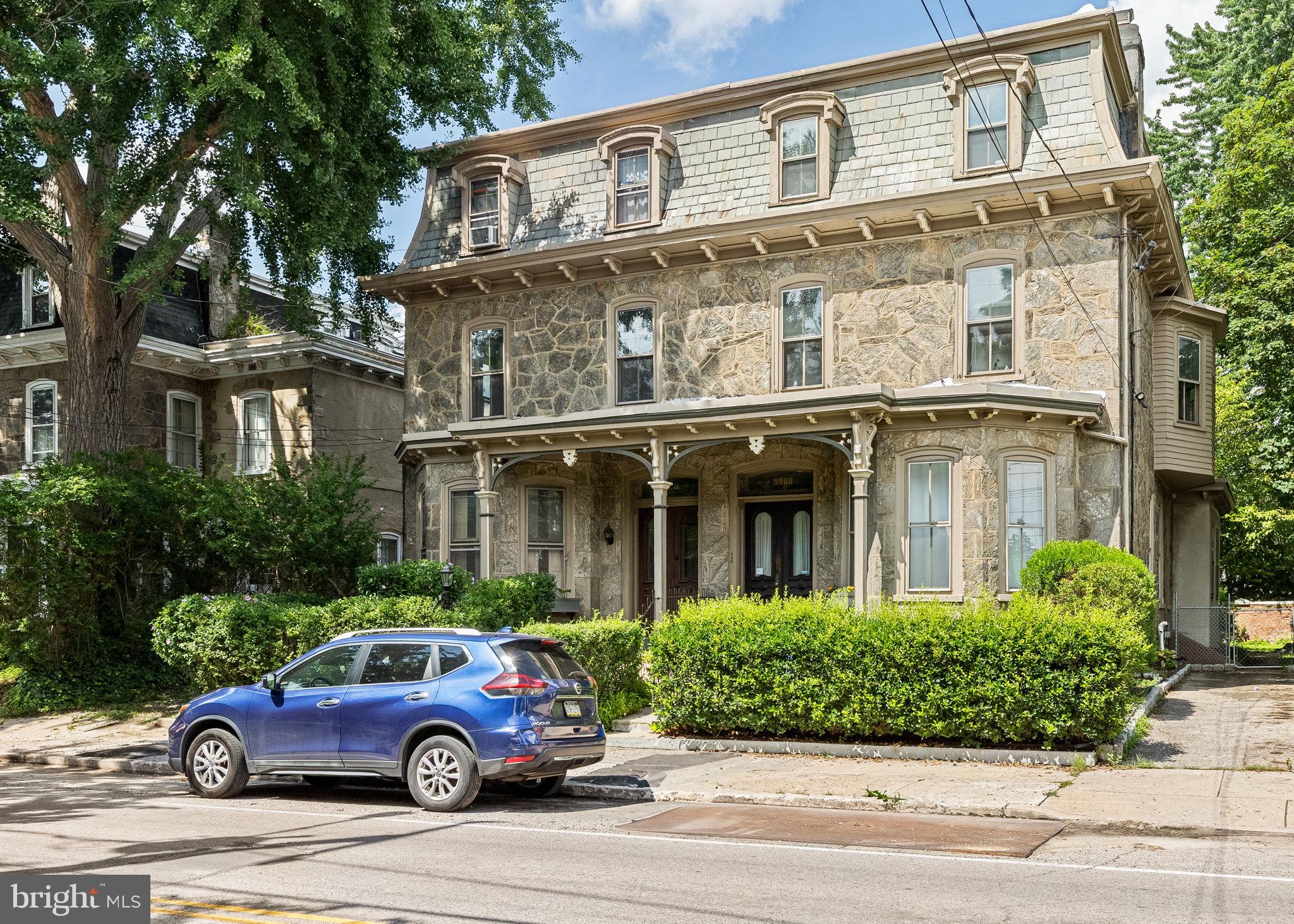 5911 Greene Street Philadelphia, PA 19144 - Photo 2 of 52 a front view of a house with a garden area
