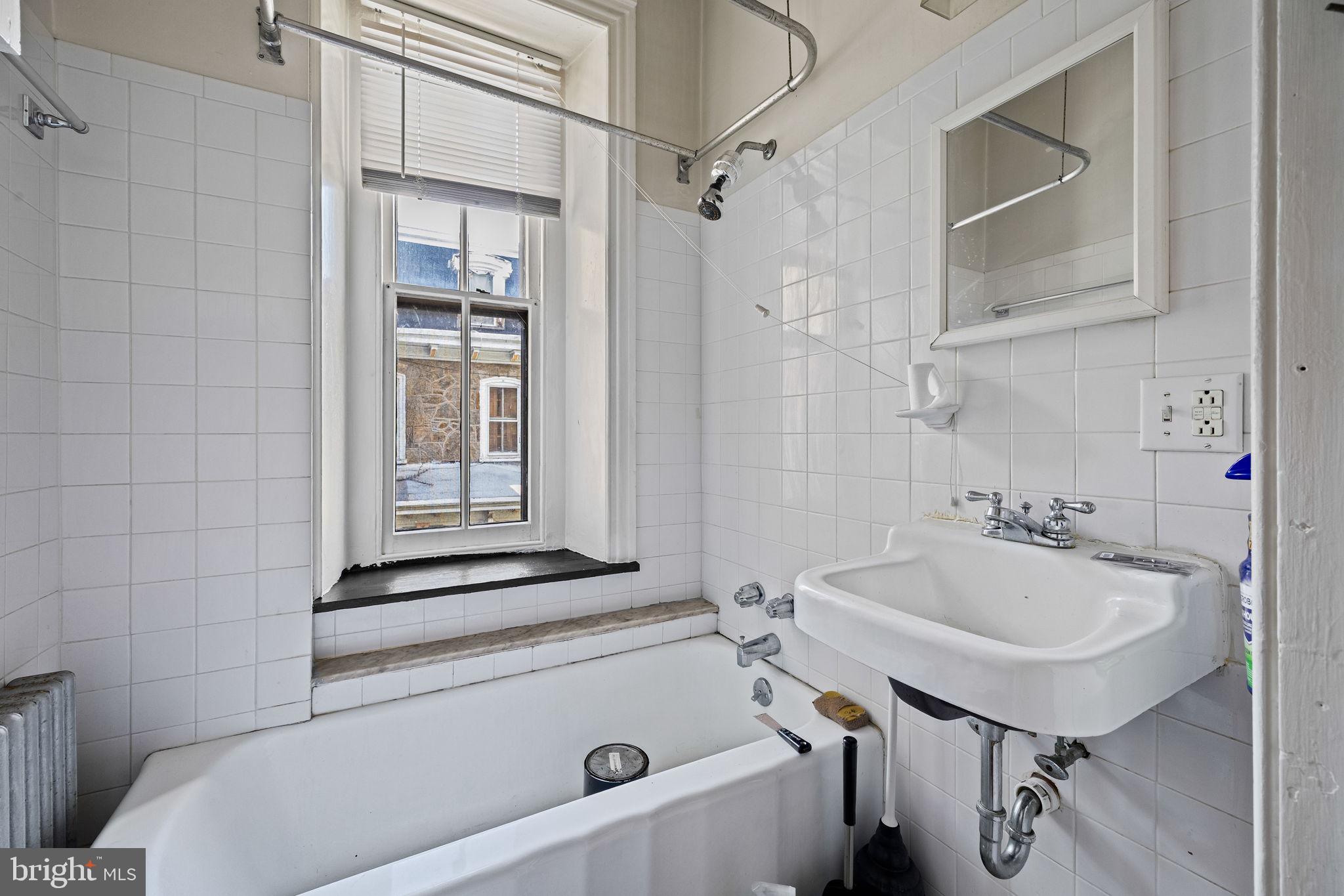 5911 Greene Street Philadelphia, PA 19144 - Photo 29 of 52 a bathroom with a sink a toilet and shower