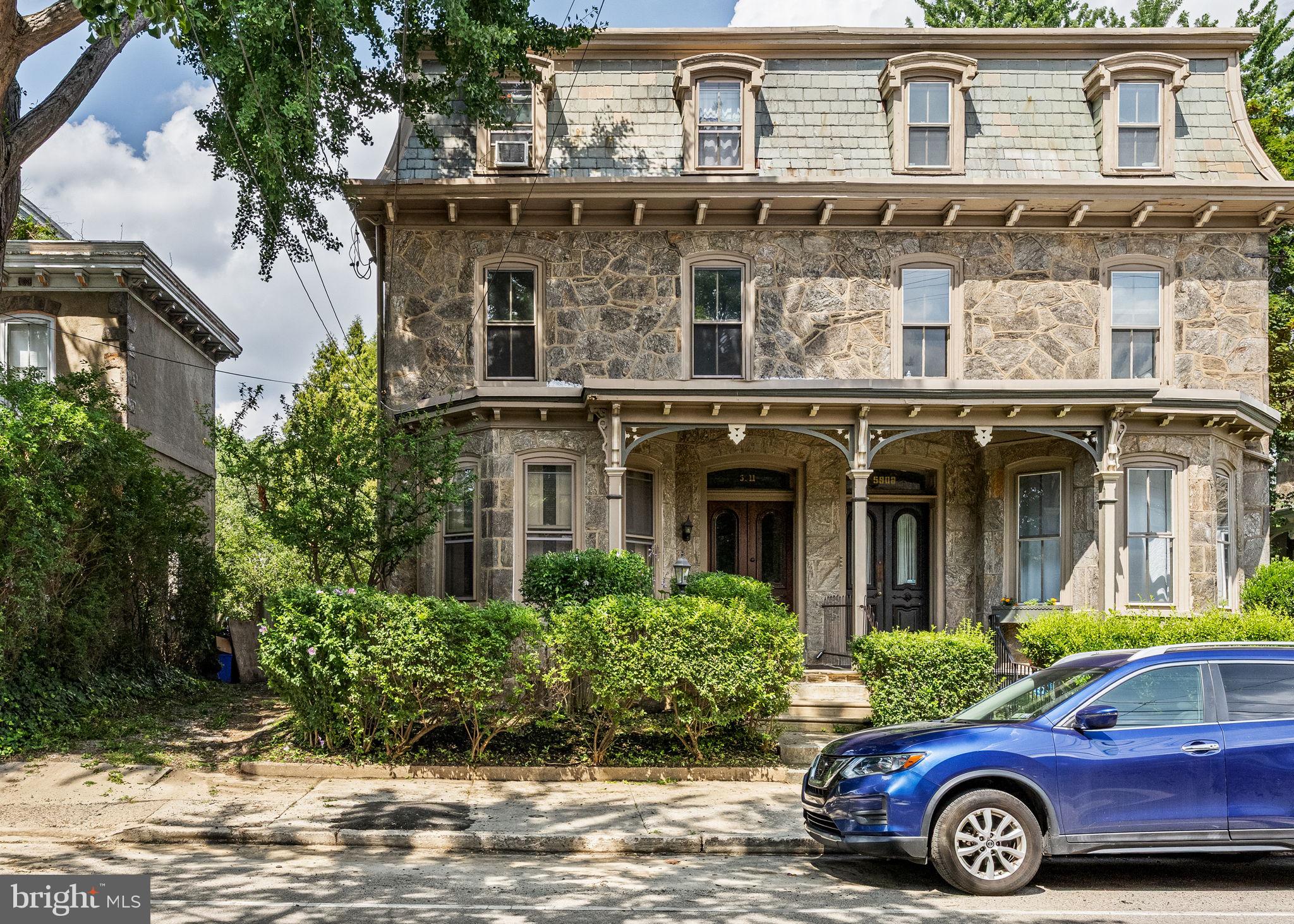 5911 Greene Street Philadelphia, PA 19144 - Photo 3 of 52 a front view of a house with a garden