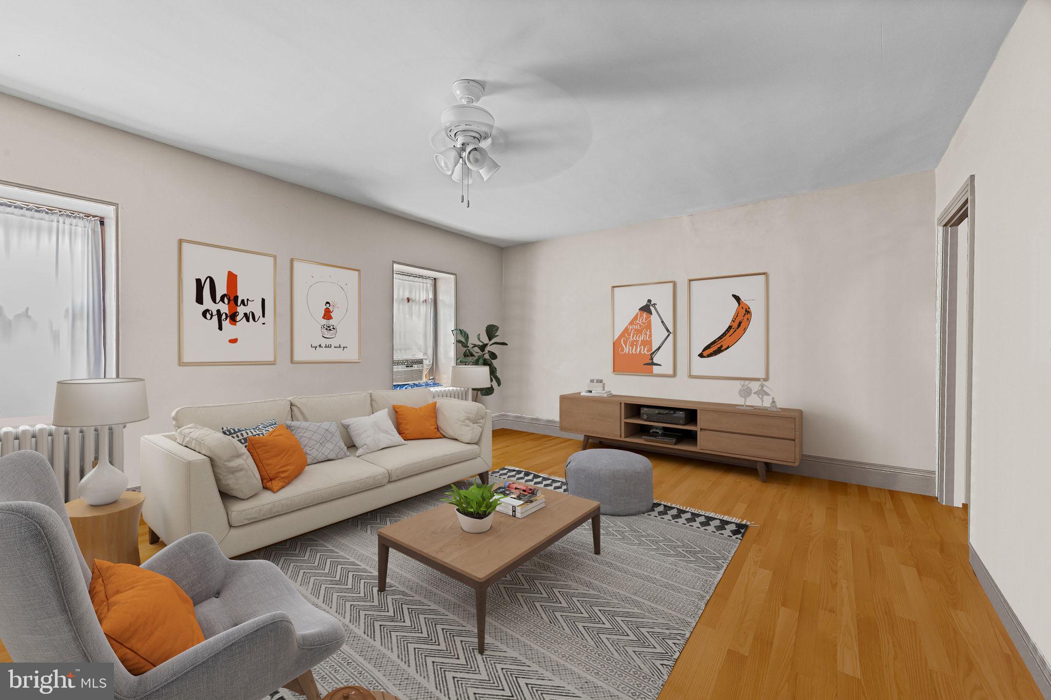 5911 Greene Street Philadelphia, PA 19144 - Photo 34 of 52 a living room with furniture and wooden floor