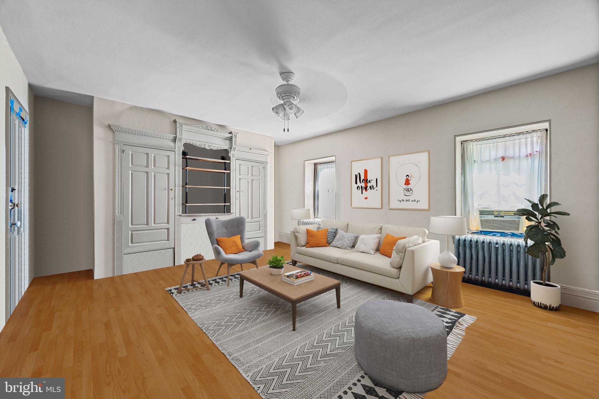 5911 Greene Street Philadelphia, PA 19144 - Photo 35 of 52 a living room with furniture and wooden floor