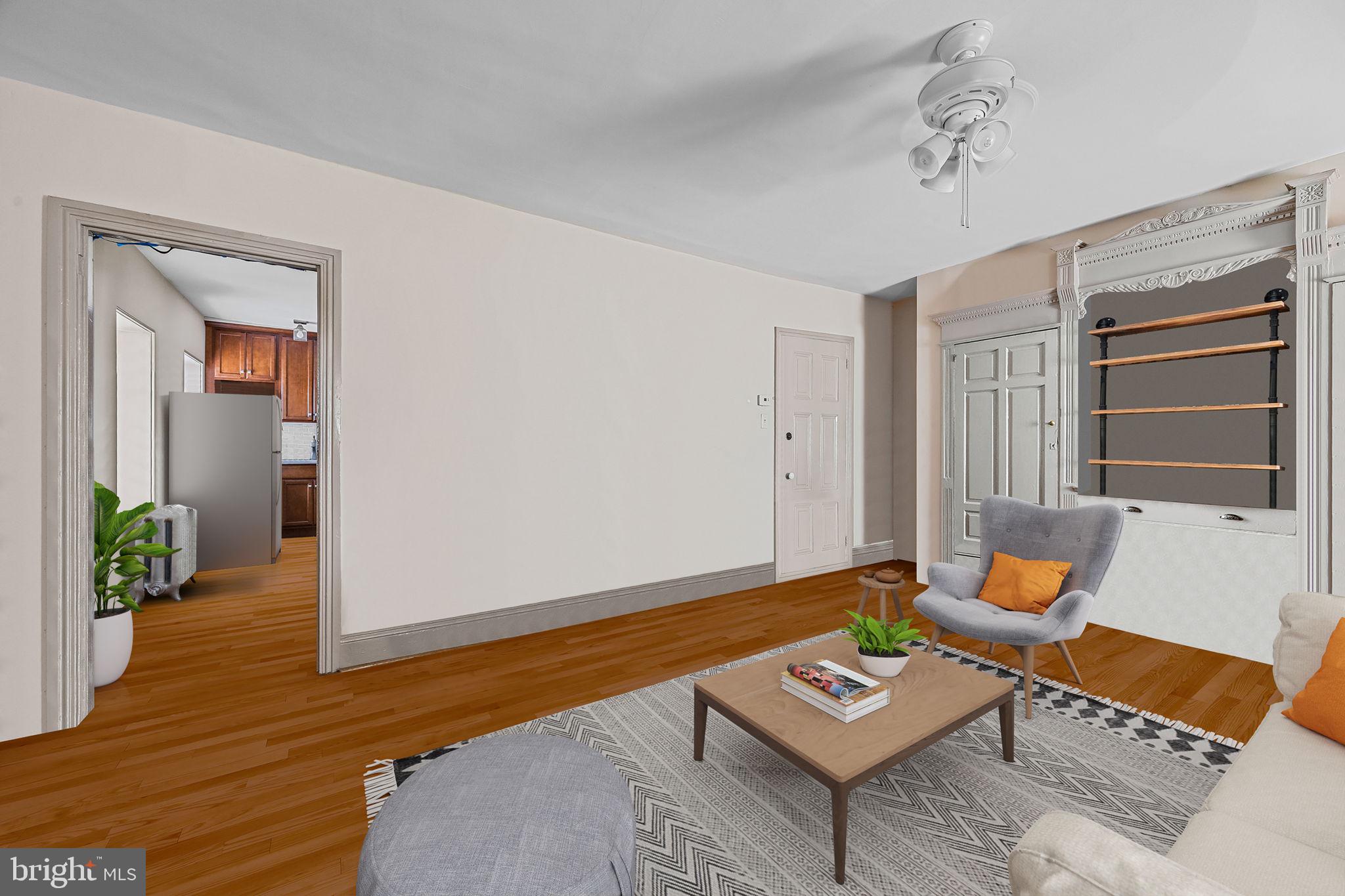 5911 Greene Street Philadelphia, PA 19144 - Photo 36 of 52 a living room with furniture and a wooden floor