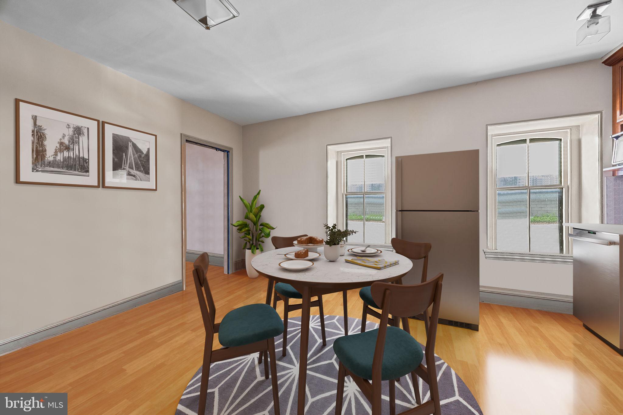 5911 Greene Street Philadelphia, PA 19144 - Photo 38 of 52 a view of a dining room with furniture and wooden floor