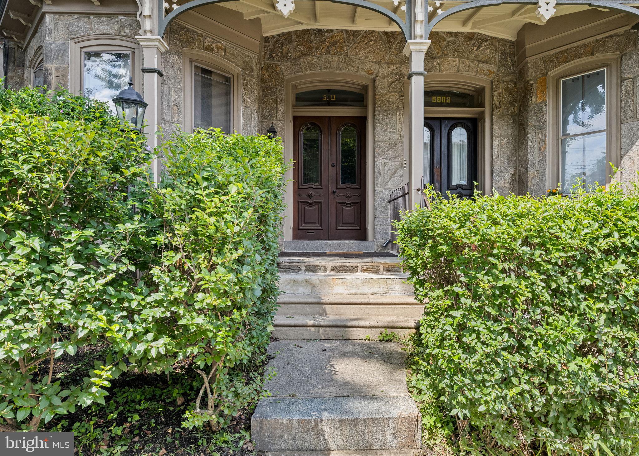 5911 Greene Street Philadelphia, PA 19144 - Photo 5 of 52 front view of a house with potted plants