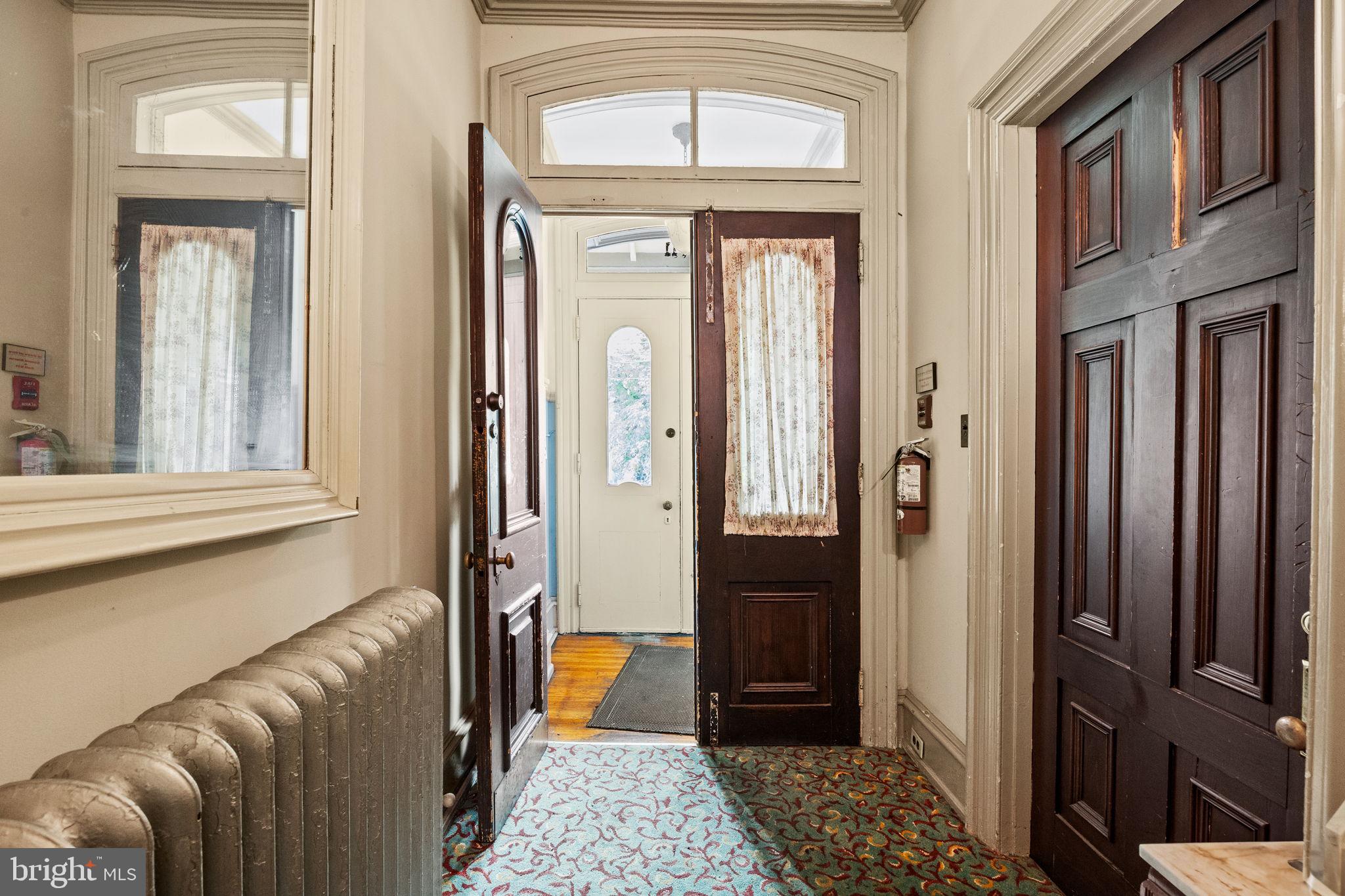 5911 Greene Street Philadelphia, PA 19144 - Photo 7 of 52 a view of a hallway with a window and a livingroom