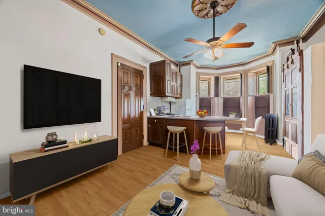 a living room with furniture and a flat screen tv