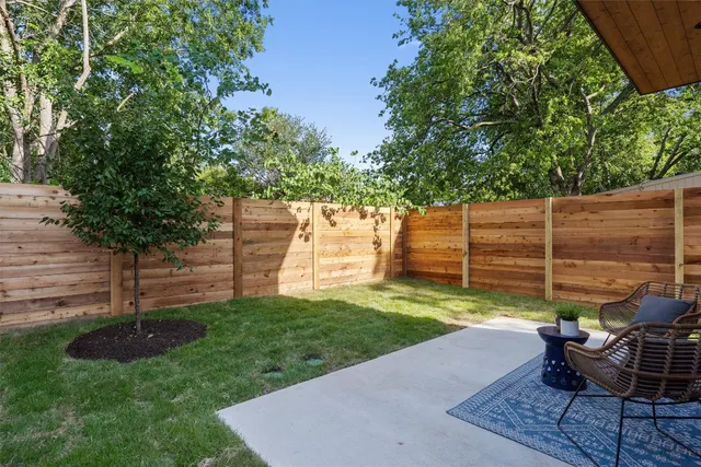 a garden with trees and some plants