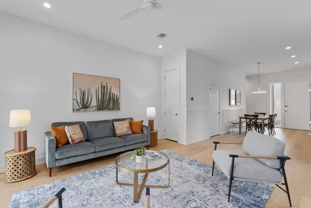 a living room with furniture and a rug