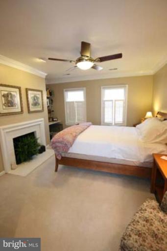 1123 Portner Road Alexandria, VA 22314 - Photo 5 of 10 a bedroom with a bed and a fireplace