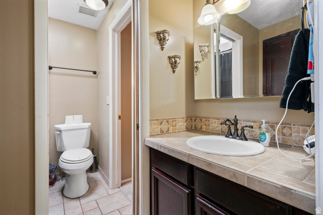 165 Pheasantbrook Drive Centerville, UT 84014 - Photo 18 of 30 Bathroom with vanity and light tile patterned floors