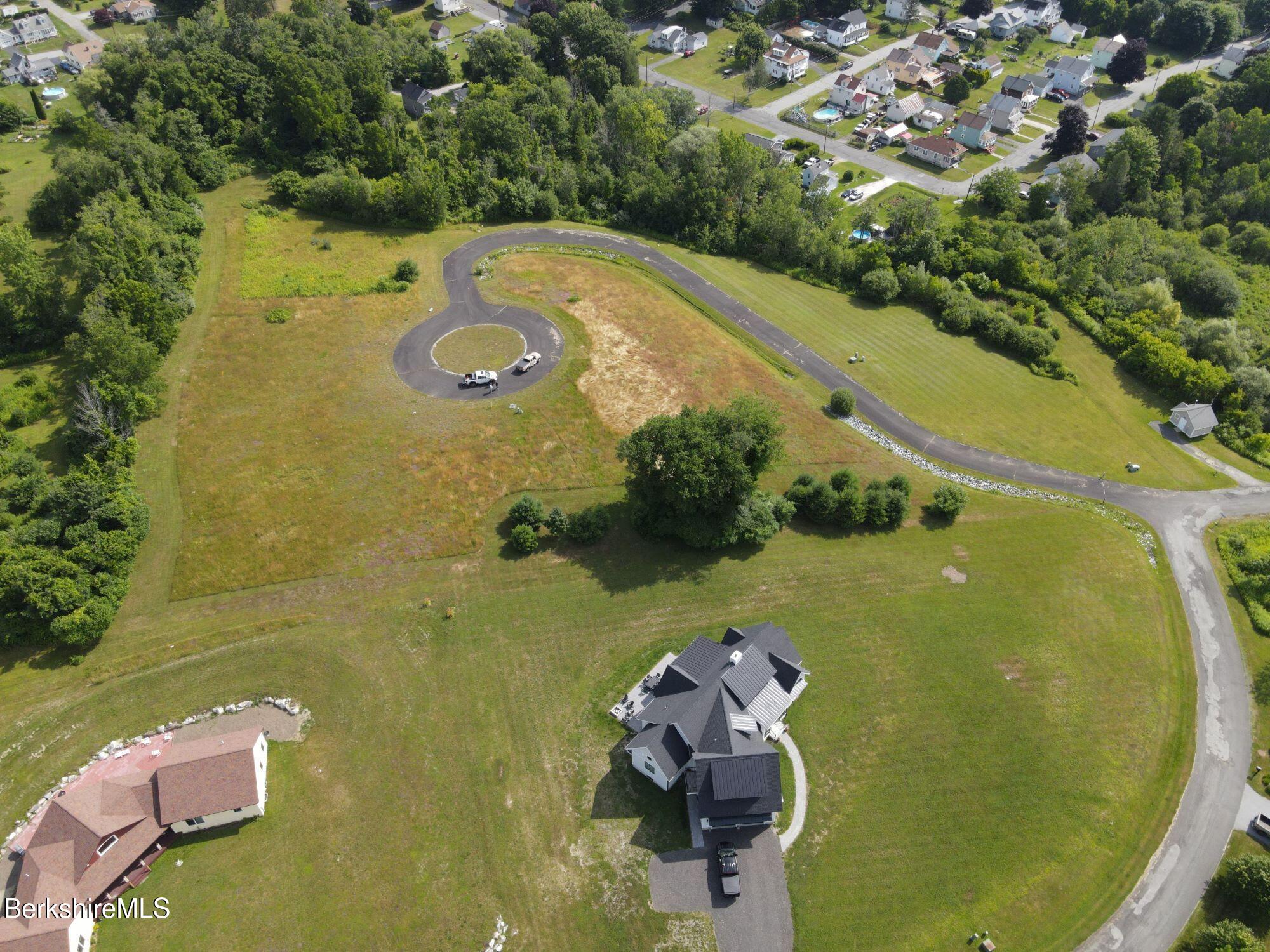 Lot 9 West Maple Street Adams, MA 01220 - Photo 5 of 9 an aerial view of a house with a yard and lake view