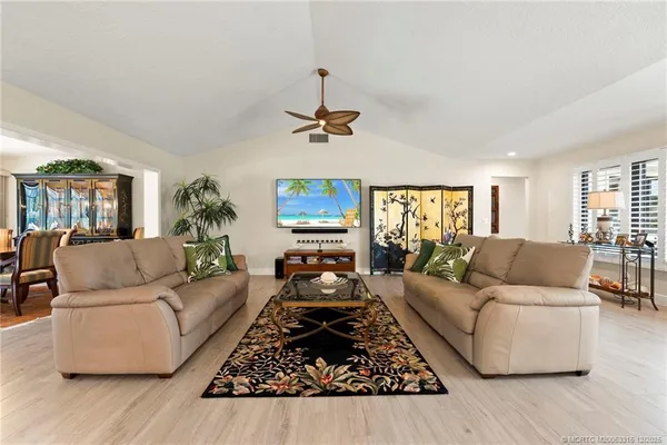 a living room with furniture or couch and a table