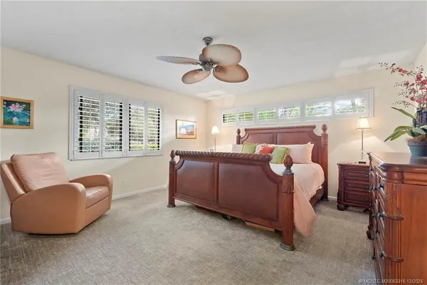 a bedroom with bed and window