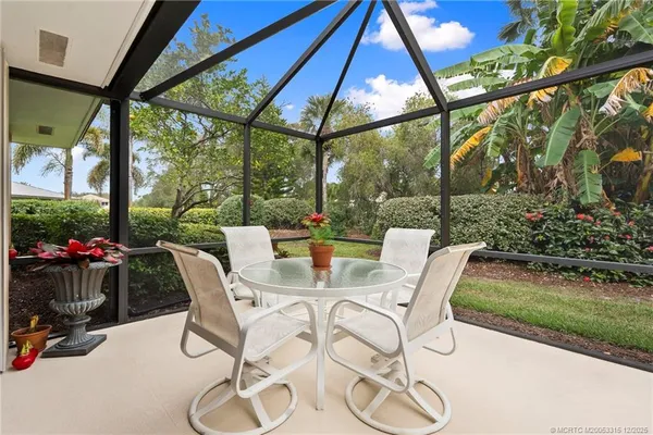 a view of an chairs and tables in the patio