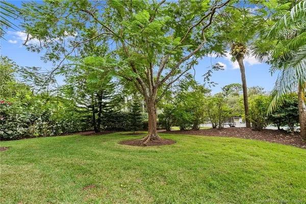 a backyard of a house with lots of green space