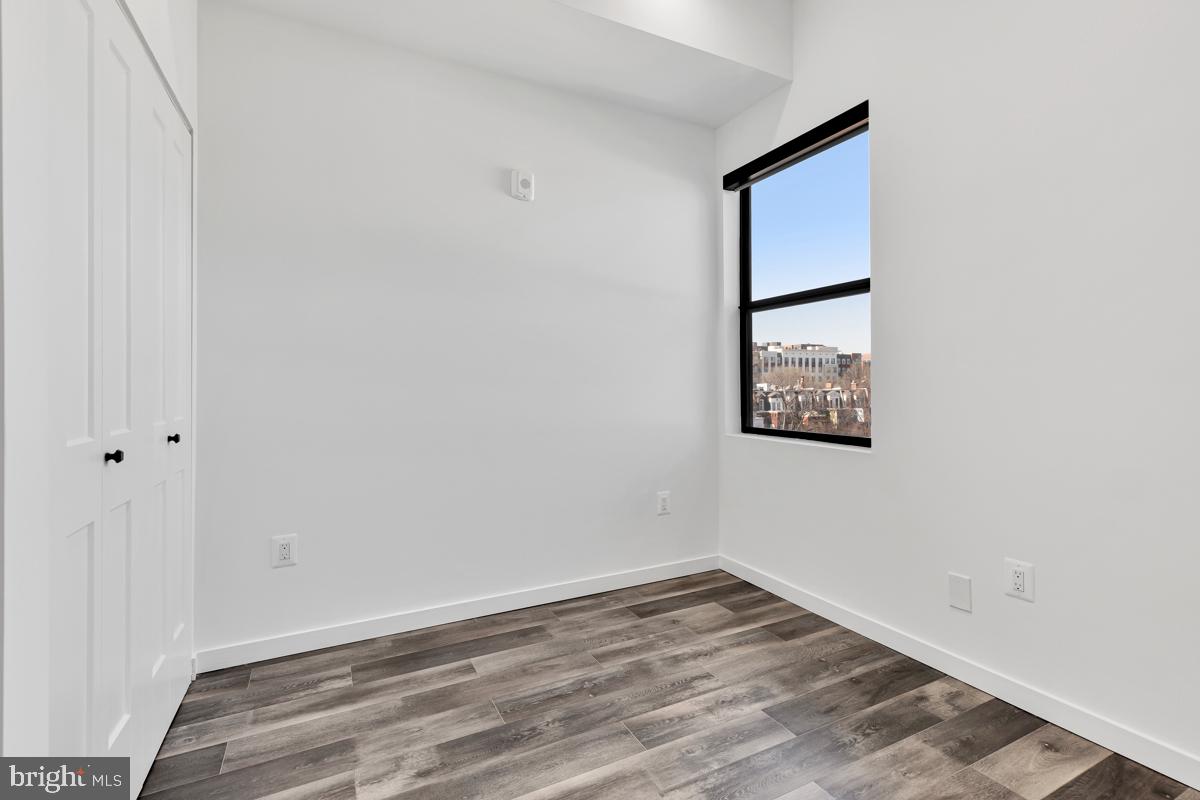 506 H Street Northeast, Unit 401 Washington, DC 20002 - Photo 16 of 19 a view of a small space with wooden floor and a window