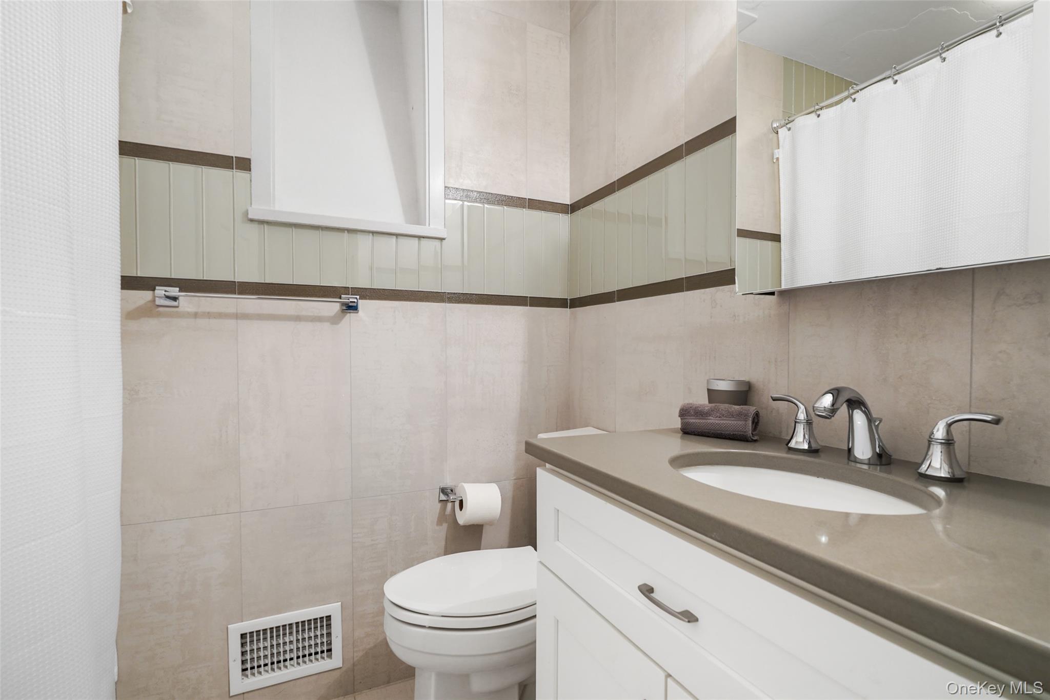 559 Pound Ridge Road Pound Ridge, NY 10576 - Photo 13 of 21 a bathroom with a toilet sink and mirror