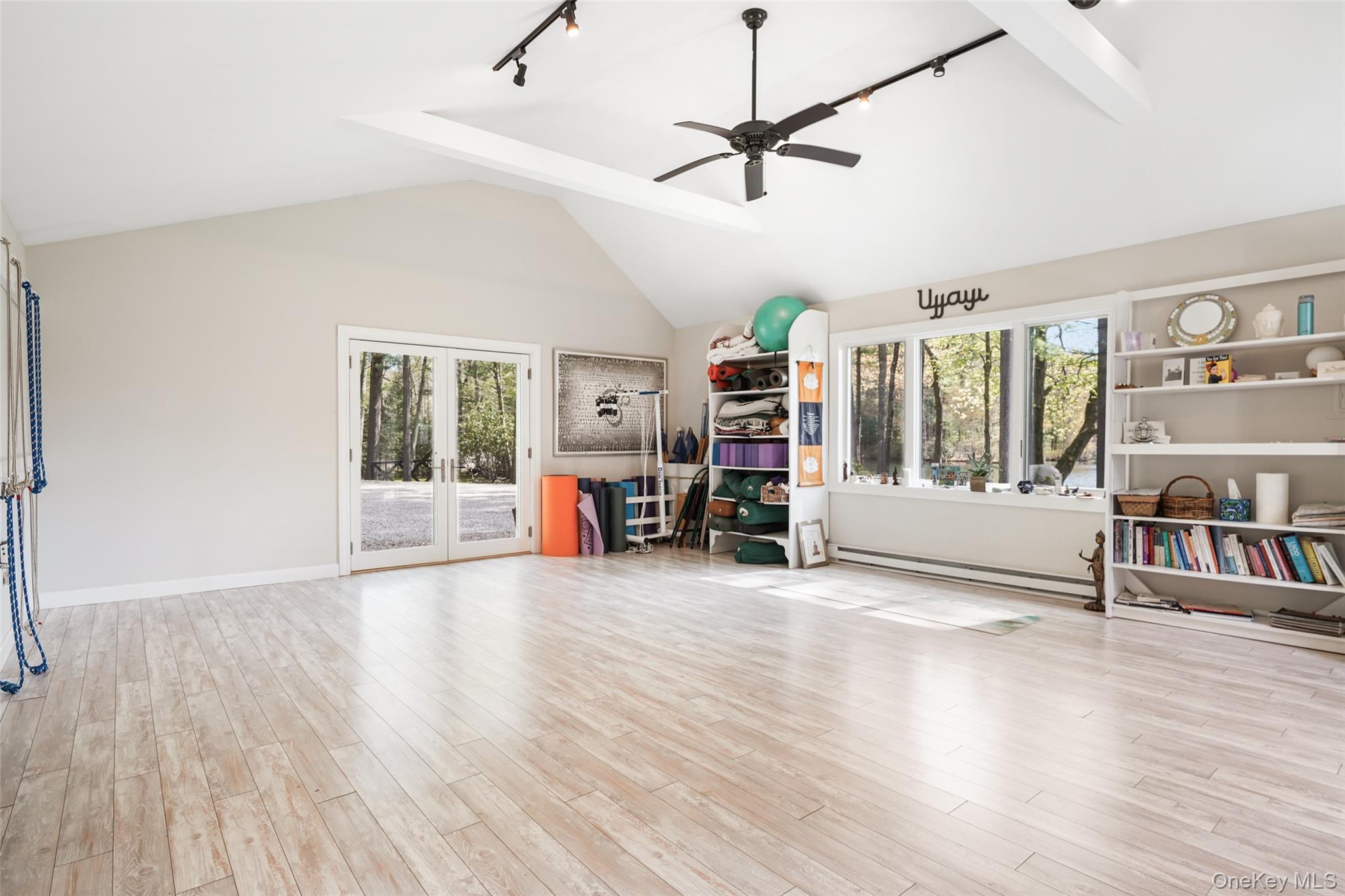 559 Pound Ridge Road Pound Ridge, NY 10576 - Photo 16 of 21 a view of a livingroom with hardwood floor and a ceiling fan