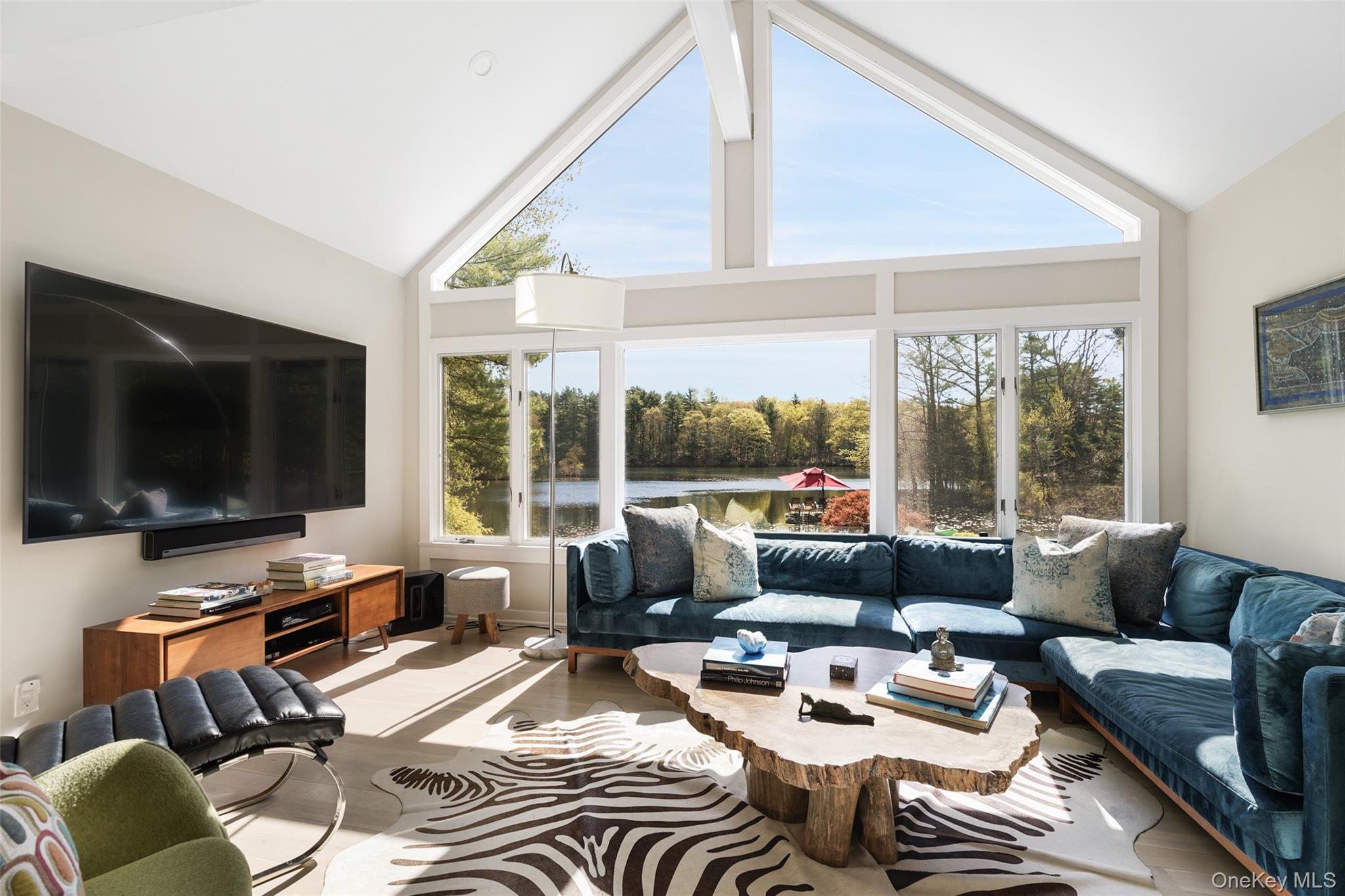 559 Pound Ridge Road Pound Ridge, NY 10576 - Photo 5 of 21 a living room with furniture and a flat screen tv