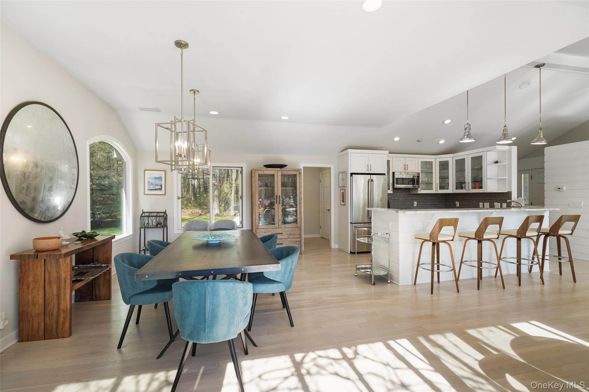 559 Pound Ridge Road Pound Ridge, NY 10576 - Photo 7 of 21 a dining room with furniture a chandelier and wooden floor