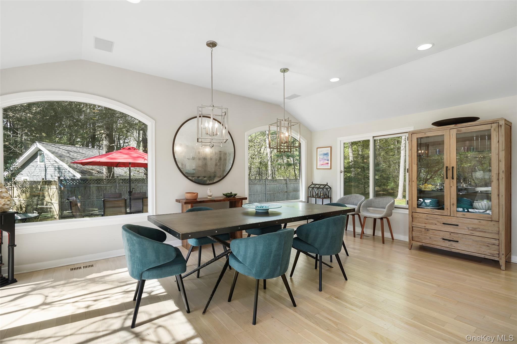 559 Pound Ridge Road Pound Ridge, NY 10576 - Photo 9 of 21 a dining room with wooden floor a glass table and chairs