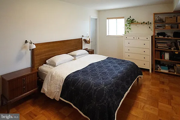 a bedroom with a bed and closet