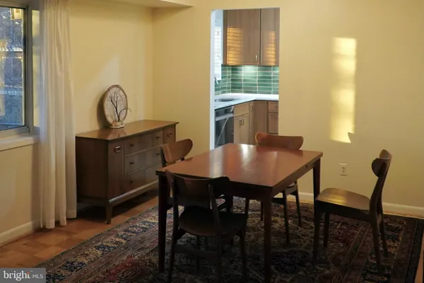 a view of a dining room with furniture and window