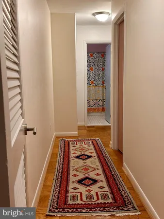 a view of bedroom with wooden floor