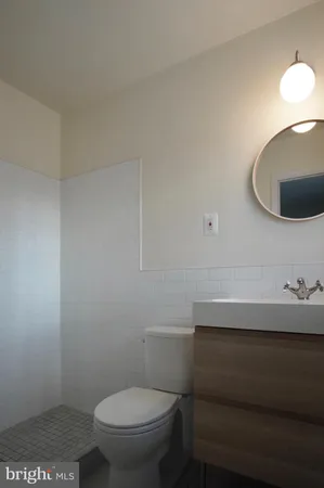 a bathroom with a toilet and a sink